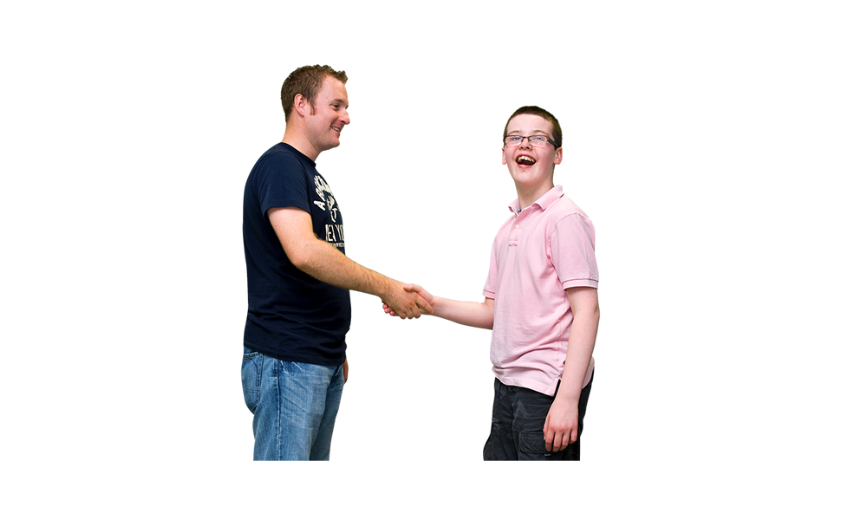Man and boy shaking hands
