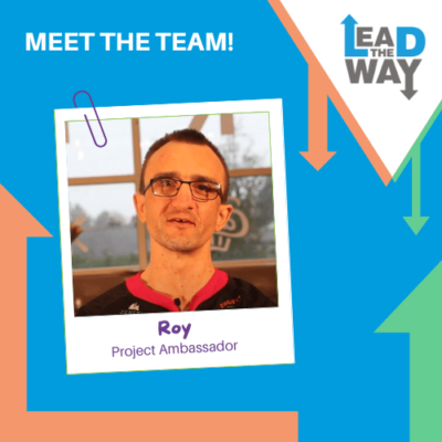 A blue background with orange and green arrows was used as decoration on this poster. Lead the Way logo on the right side of the poster. On the left side of the poster is an image of Roy: a man with glasses. The Image also shows his name: Roy and his job role, Project Ambassador.